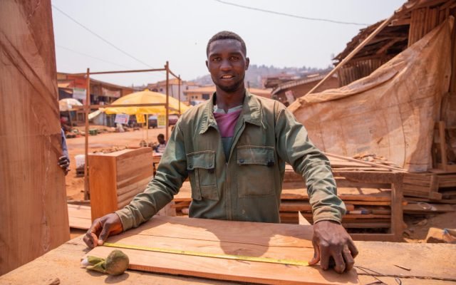 carpenter-african-village-taking-measurements-make-piece-furniture carpenter-african-village-taking-measurements-make-piece-furniture